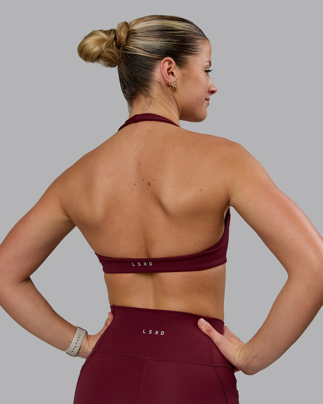 Woman wearing Challenger Sports Bra - Cordovan