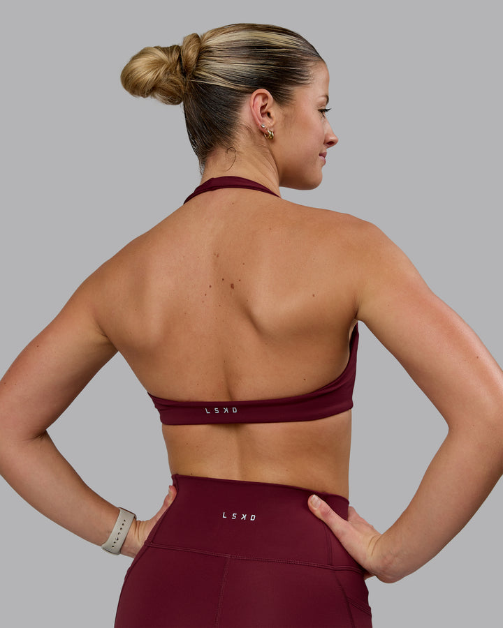 Woman wearing Challenger Sports Bra - Cordovan
