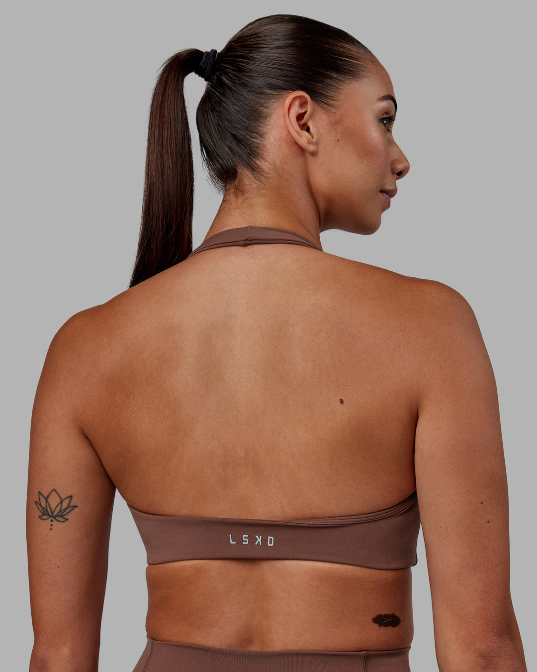 Woman wearing Challenger Sports Bra - Dull Rust