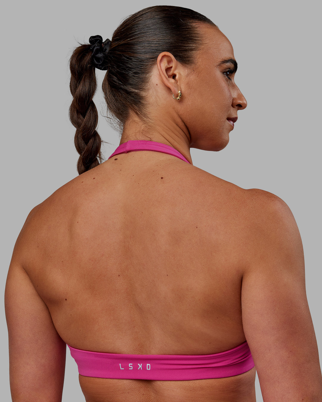 Woman wearing Challenger Sports Bra - Fuchsia Pink