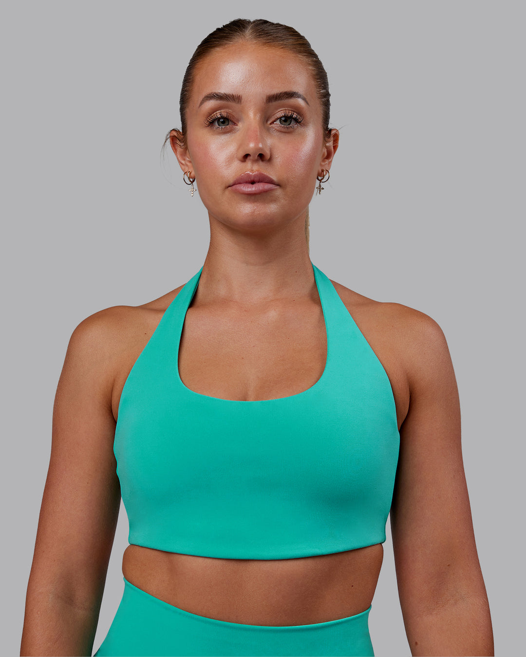 Woman wearing Challenger Sports Bra - Turquoise Tide