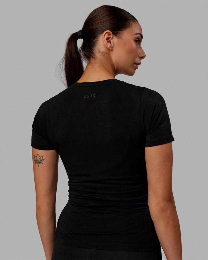 Woman wearing Charge PimaFLX-Lite Fitted Tee - Black