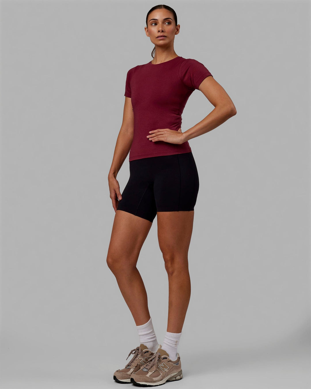 Woman wearing Charge PimaFLX-Lite Fitted Tee - Cranberry