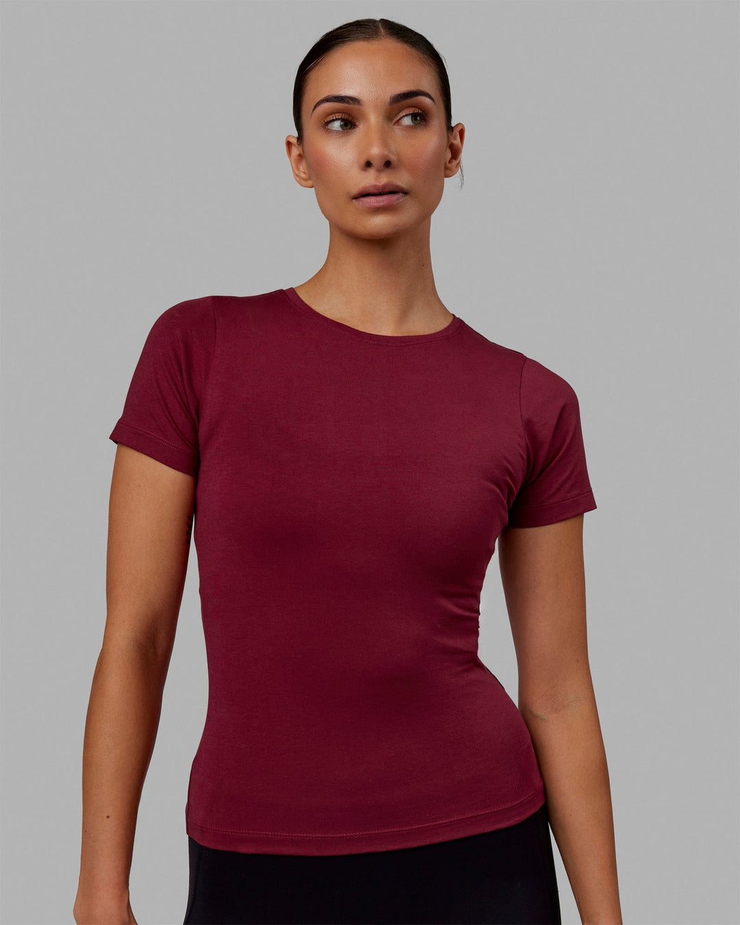 Woman wearing Charge PimaFLX-Lite Fitted Tee - Cranberry