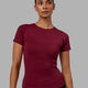 Woman wearing Charge PimaFLX-Lite Fitted Tee - Cranberry