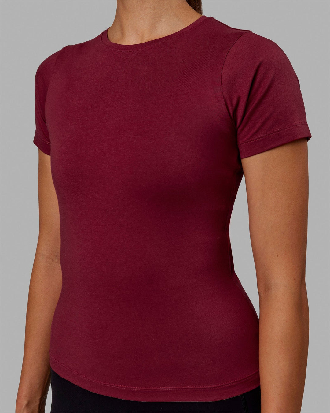 Woman wearing Charge PimaFLX-Lite Fitted Tee - Cranberry