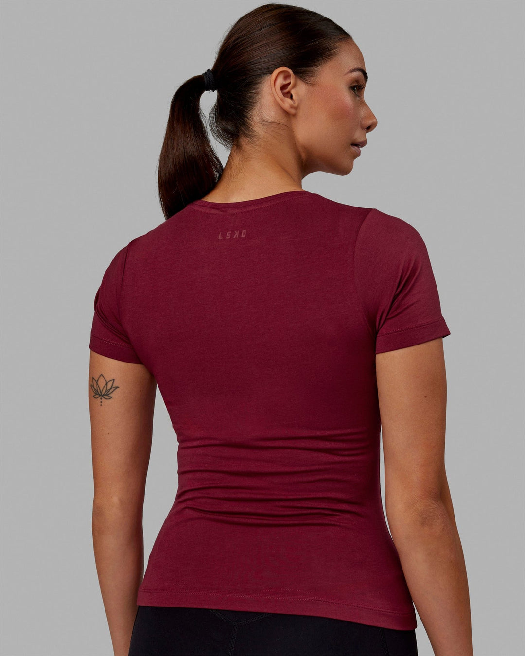 Woman wearing Charge PimaFLX-Lite Fitted Tee - Cranberry