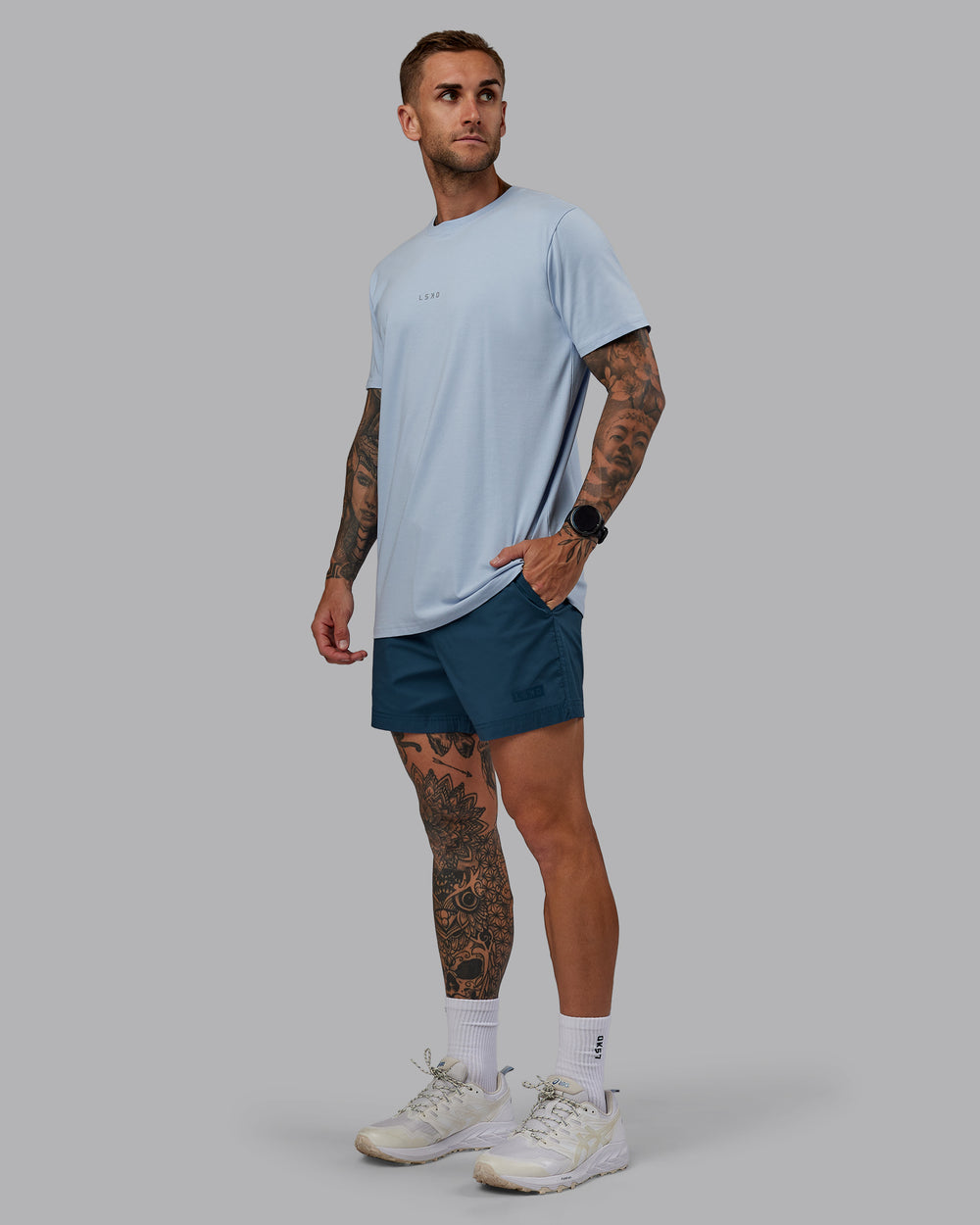 Man wearing Daily 5" Shorts - Indigo