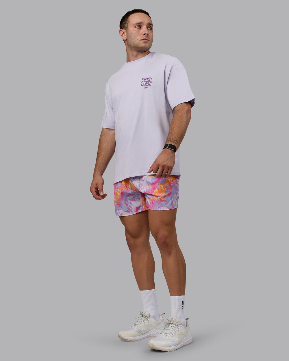 Man wearing Daily 5" Swim Shorts - React Pink-Orange