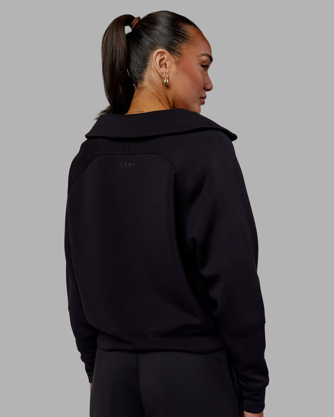 Woman wearing Elevate SoftTouch 1/2 Zip Sweater - Black-Black