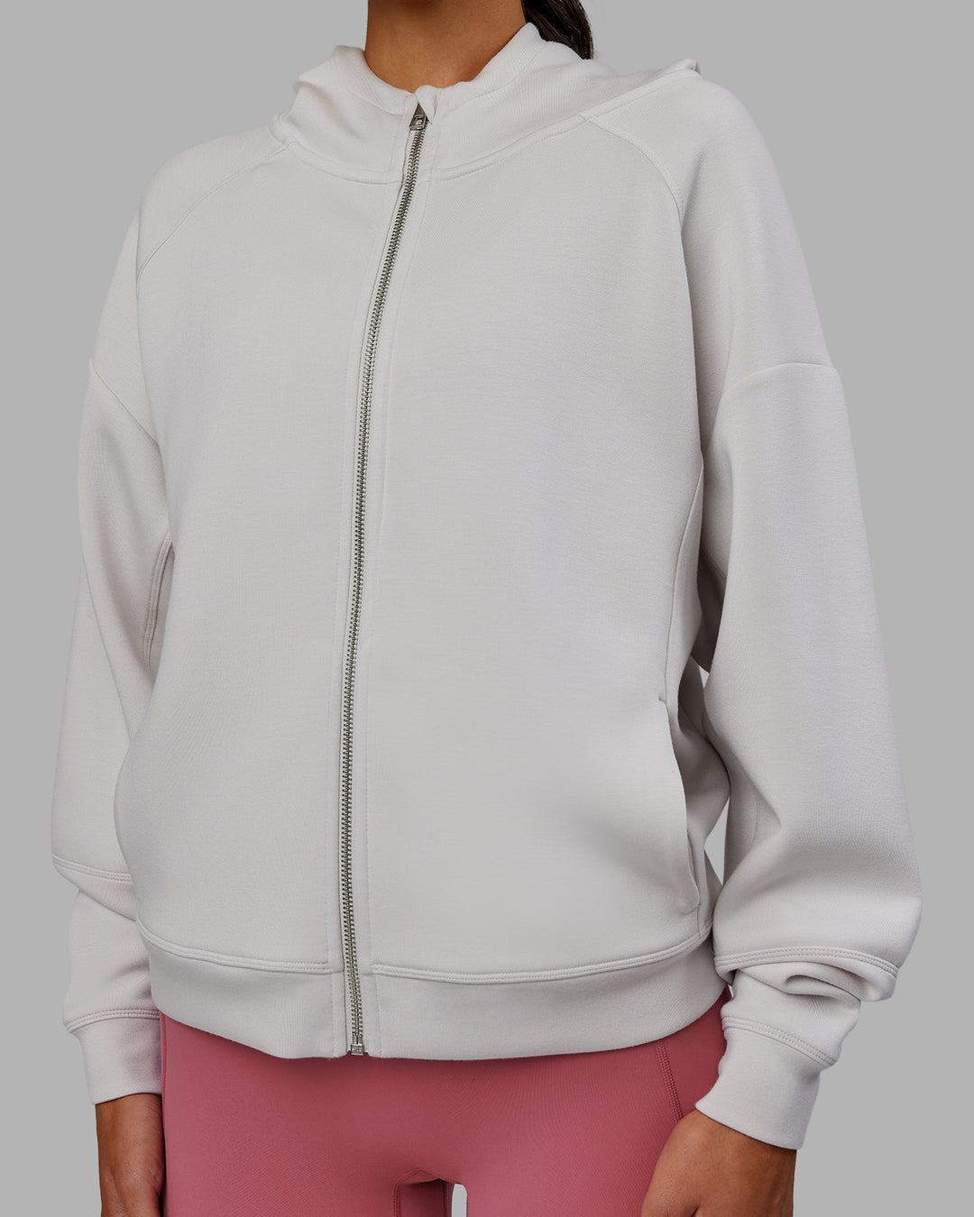 Woman wearing Elevate SoftTouch Zip Through Hoodie - Clay-Clay