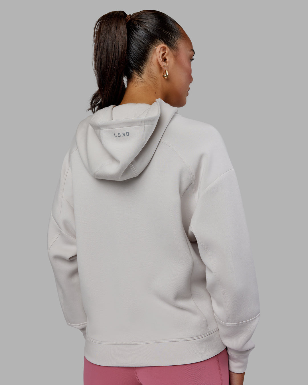 Woman wearing Elevate SoftTouch Zip Through Hoodie - Clay-Clay