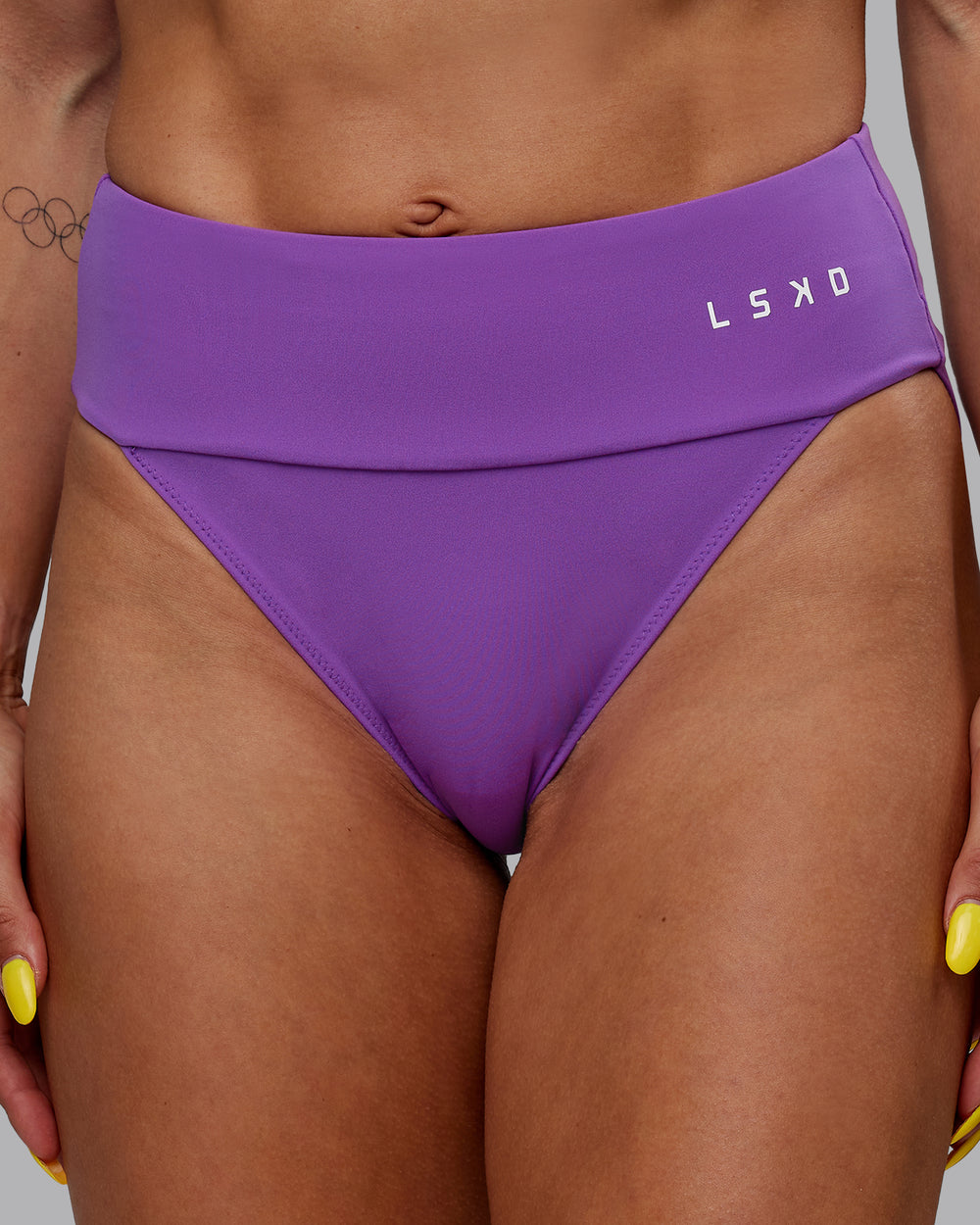 Woman wearing Elevate Sprinting Briefs - Purple Swirl