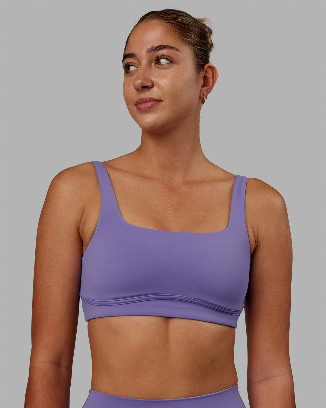 Woman wearing Elevation Sports Bra - Dahlia Purple