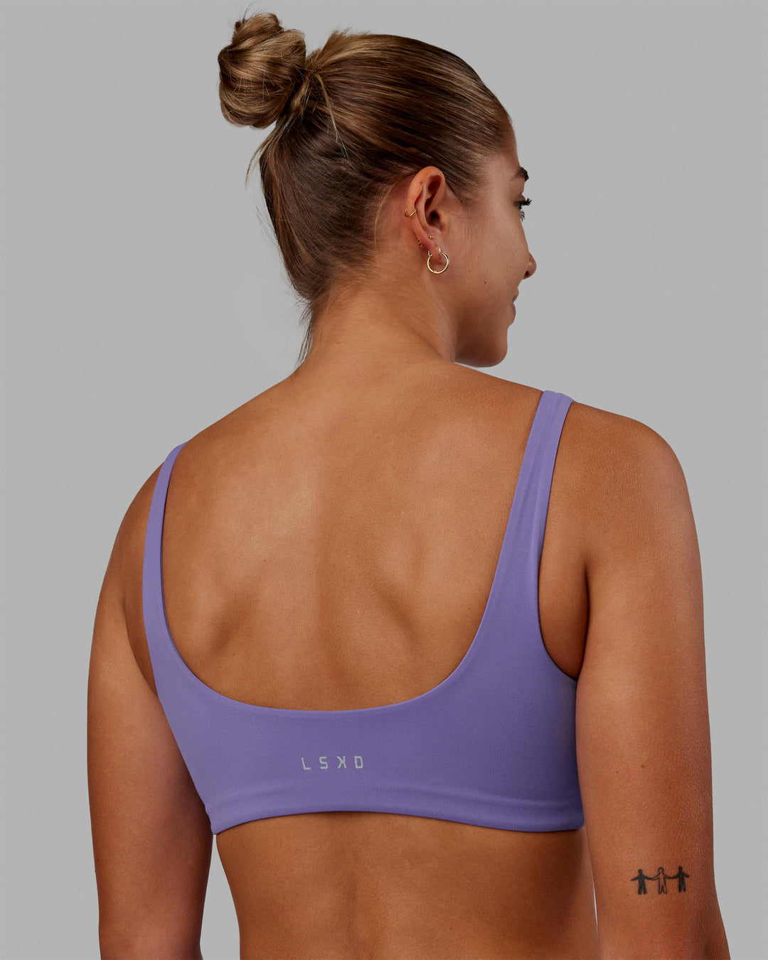 Woman wearing Elevation Sports Bra - Dahlia Purple