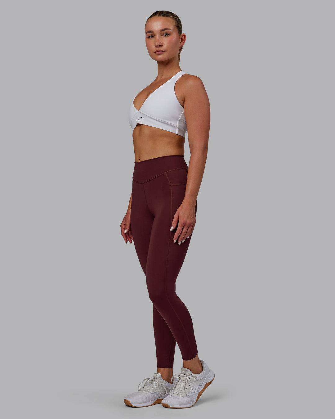 Woman wearing Elite 7/8 Length Leggings - Dark Cherry