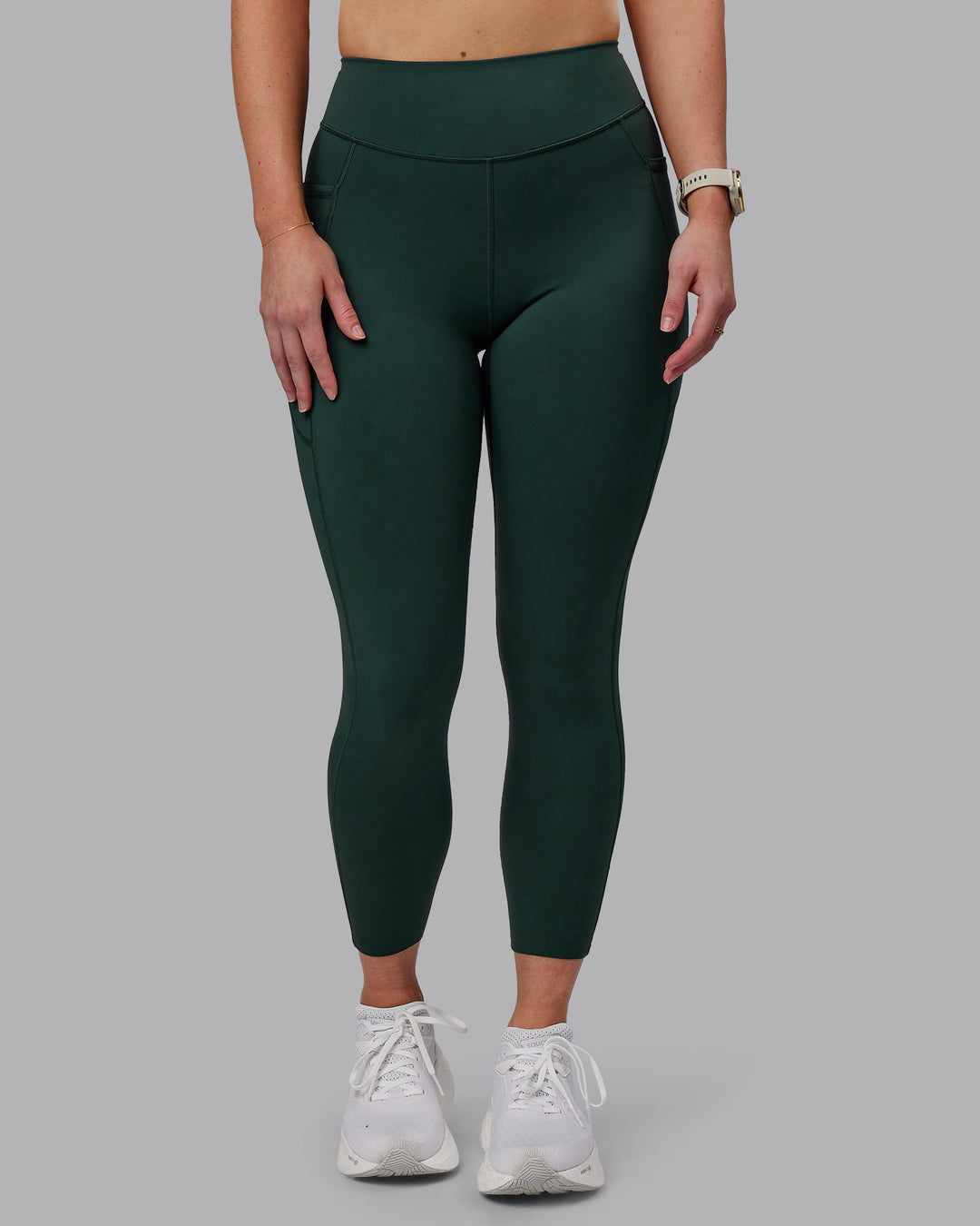 Woman wearing Elite 7/8 Length Leggings - Vital Green