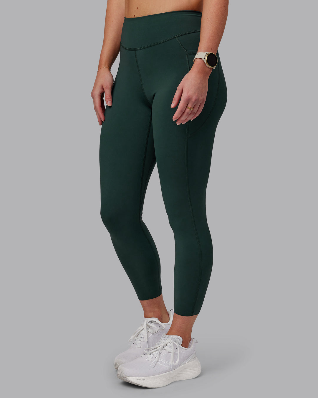 Woman wearing Elite 7/8 Length Leggings - Vital Green