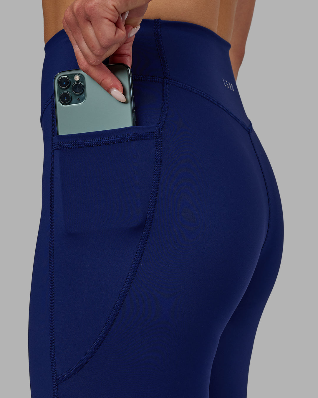 Woman wearing Elite Full Length Leggings - Midnight Blue