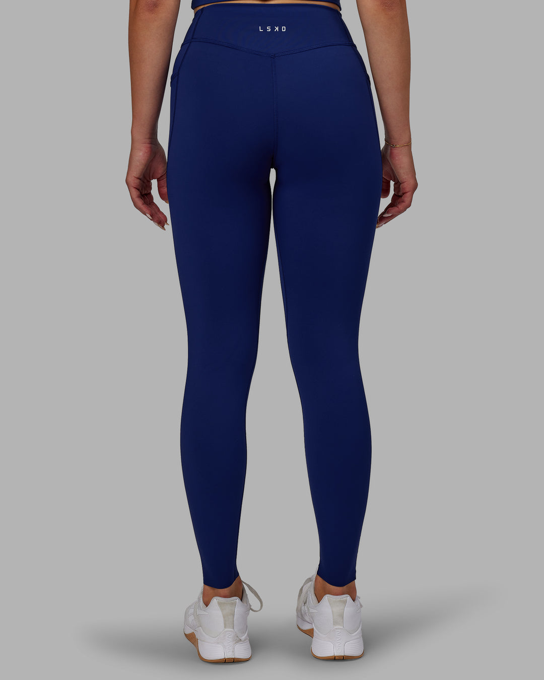 Woman wearing Elite Full Length Leggings - Midnight Blue