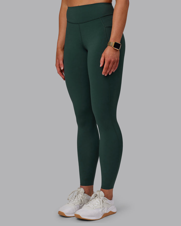 Woman wearing Elite Full Length Leggings - Vital Green
