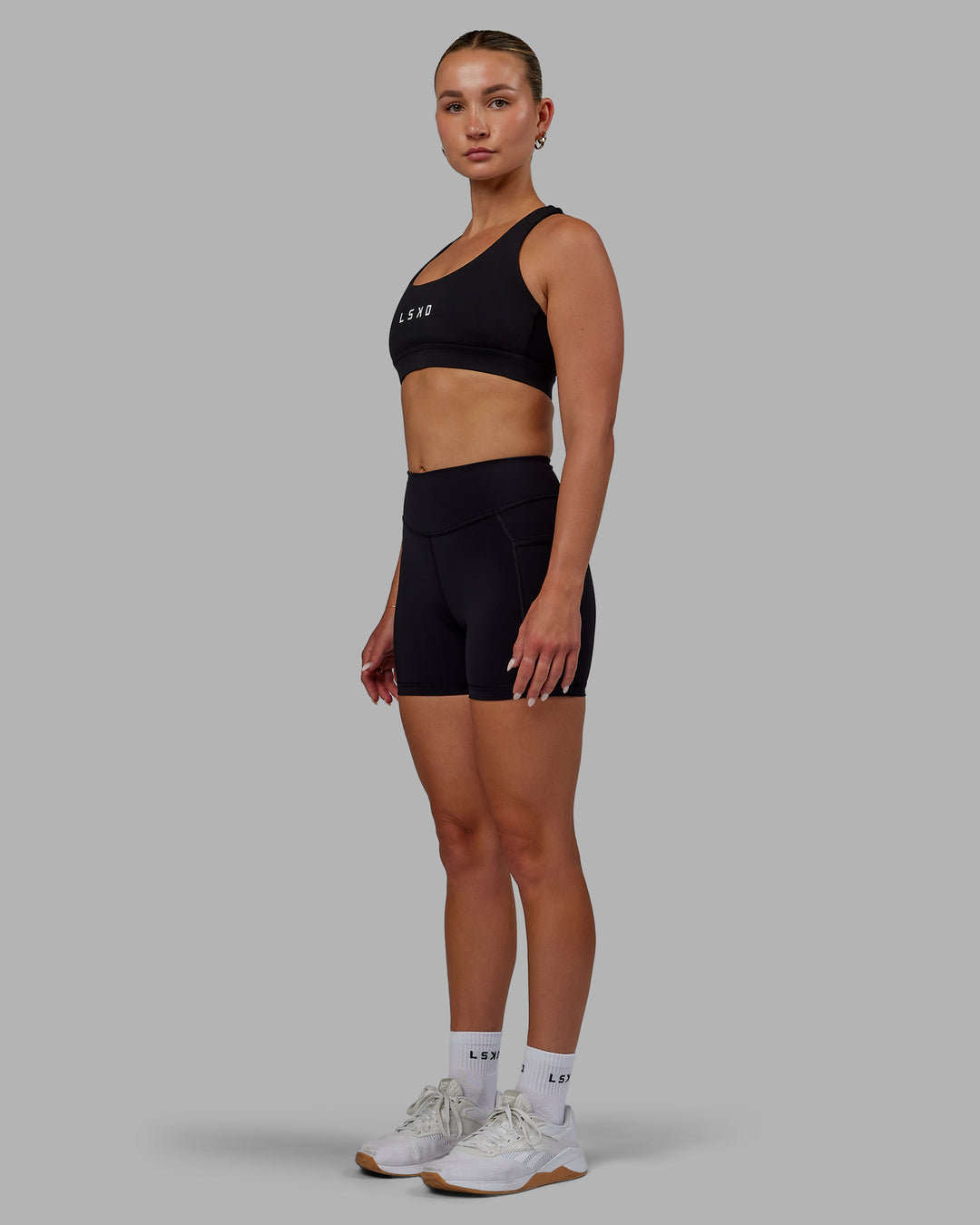 Woman wearing Elite X-Length Shorts - Black