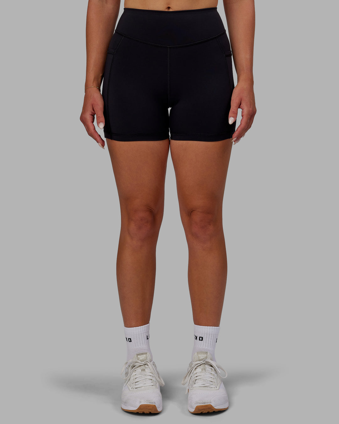 Woman wearing Elite X-Length Shorts - Black