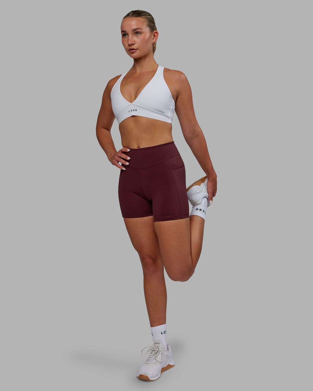 Woman wearing Elite X-Length Shorts - Dark Cherry