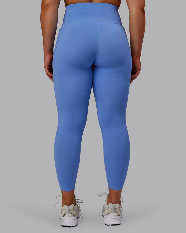 Woman wearing Elixir 7/8 Length Tights With Pockets - Ultramarine
