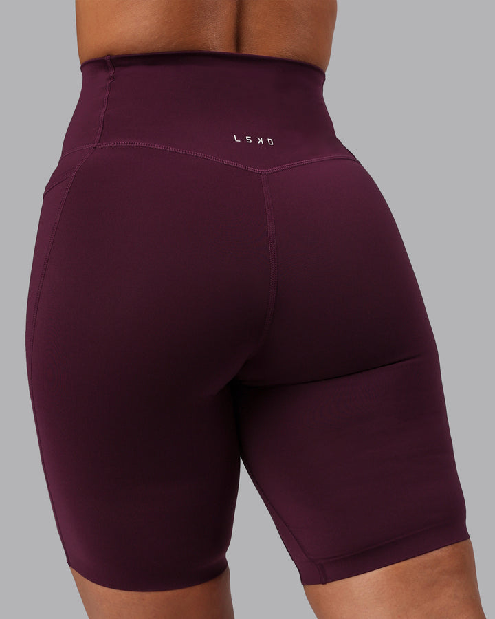 Woman wearing Elixir Bike Shorts With Pockets - Cherry Lacquer
