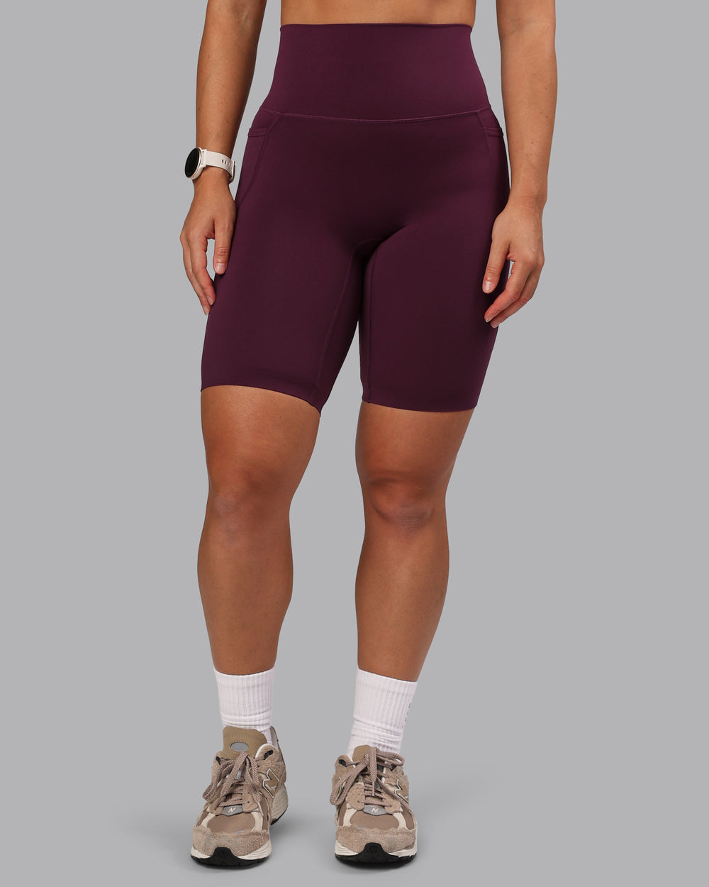 Woman wearing Elixir Bike Shorts With Pockets - Cherry Lacquer