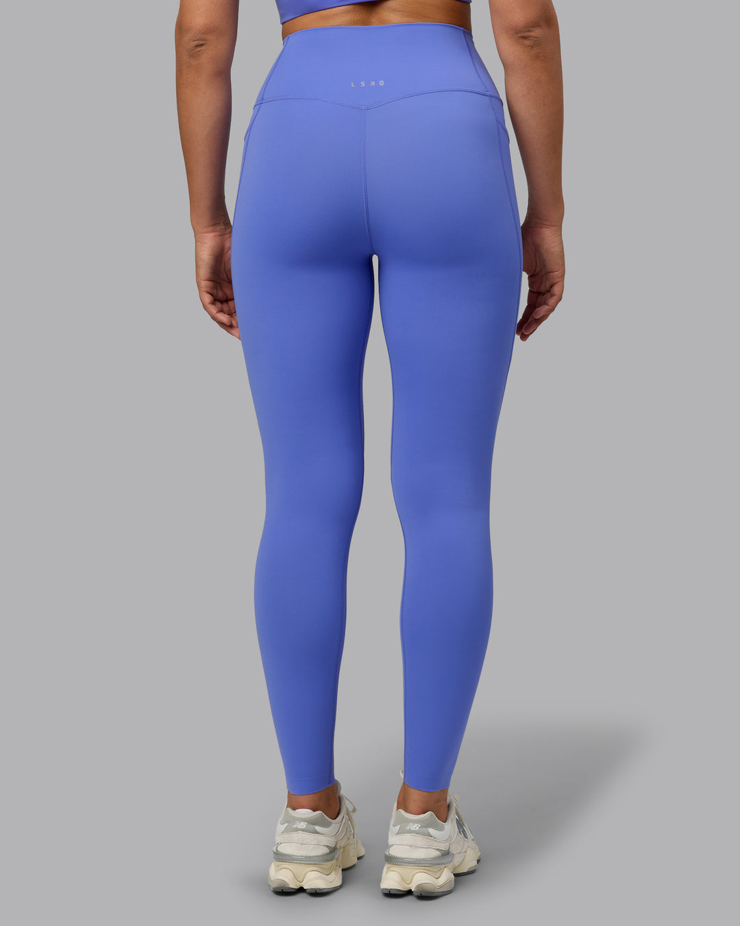 Woman wearing Elixir Full Length Tights With Pockets - Baja Blue