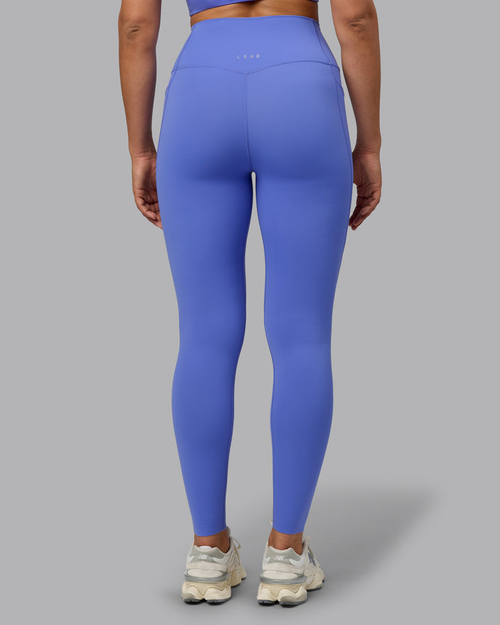 Woman wearing Elixir Full Length Tights With Pockets - Baja Blue
