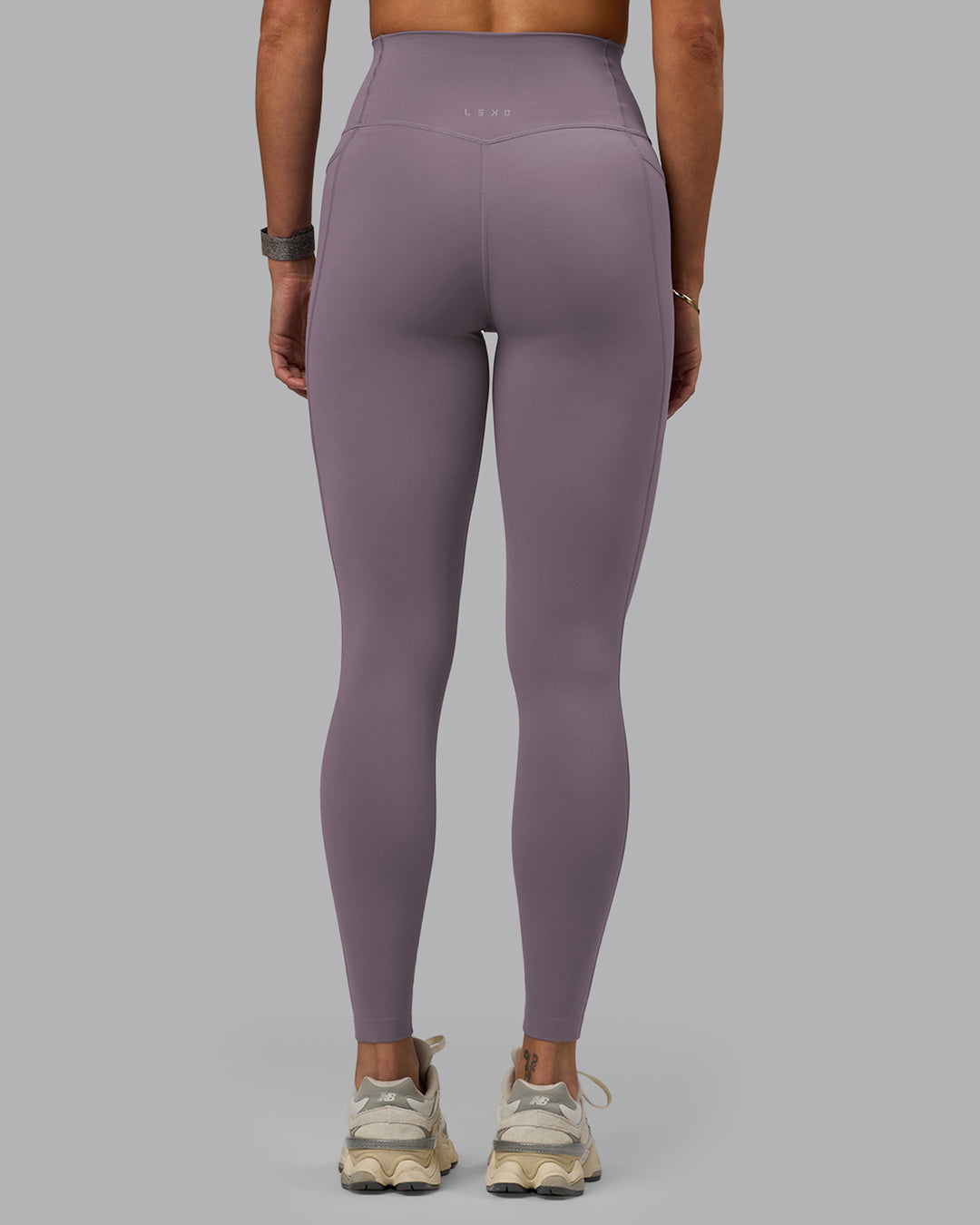 Woman wearing Elixir Full Length Tights With Pockets - Purple Sage