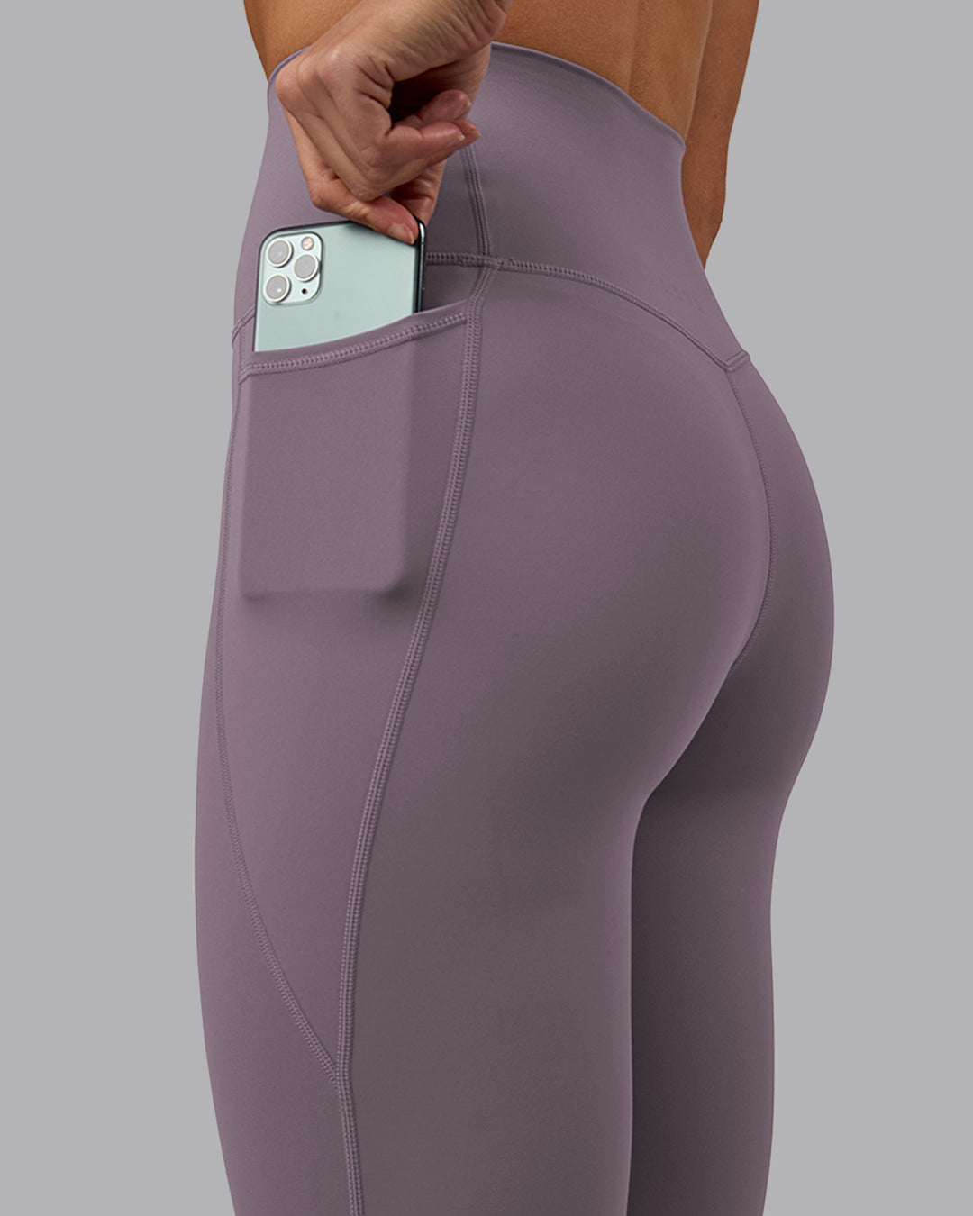 Woman wearing Elixir Full Length Tights With Pockets - Purple Sage