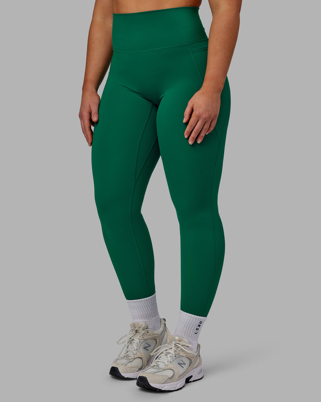 Woman wearing Elixir Full Length Tights With Pockets - Malachite