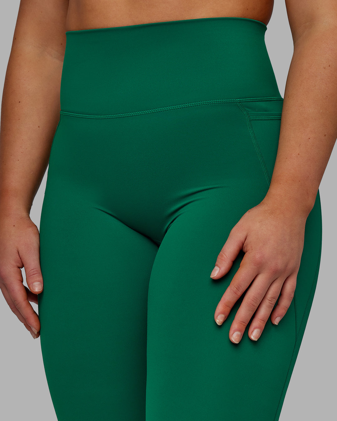 Woman wearing Elixir Full Length Tights With Pockets - Malachite