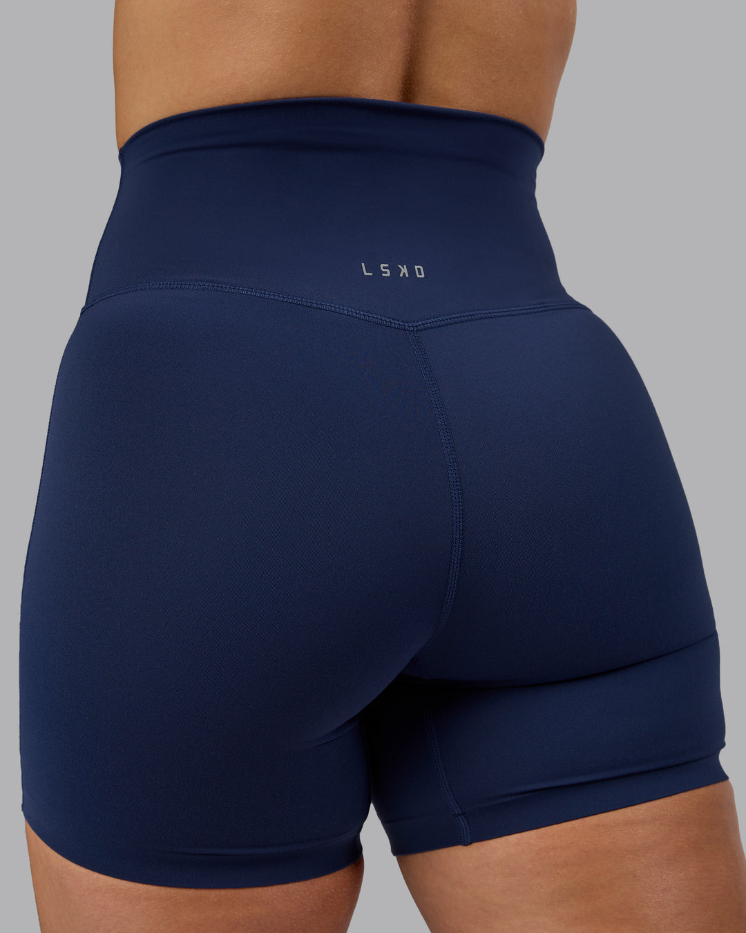 Woman wearing Elixir Mid Short Tights - Future Navy