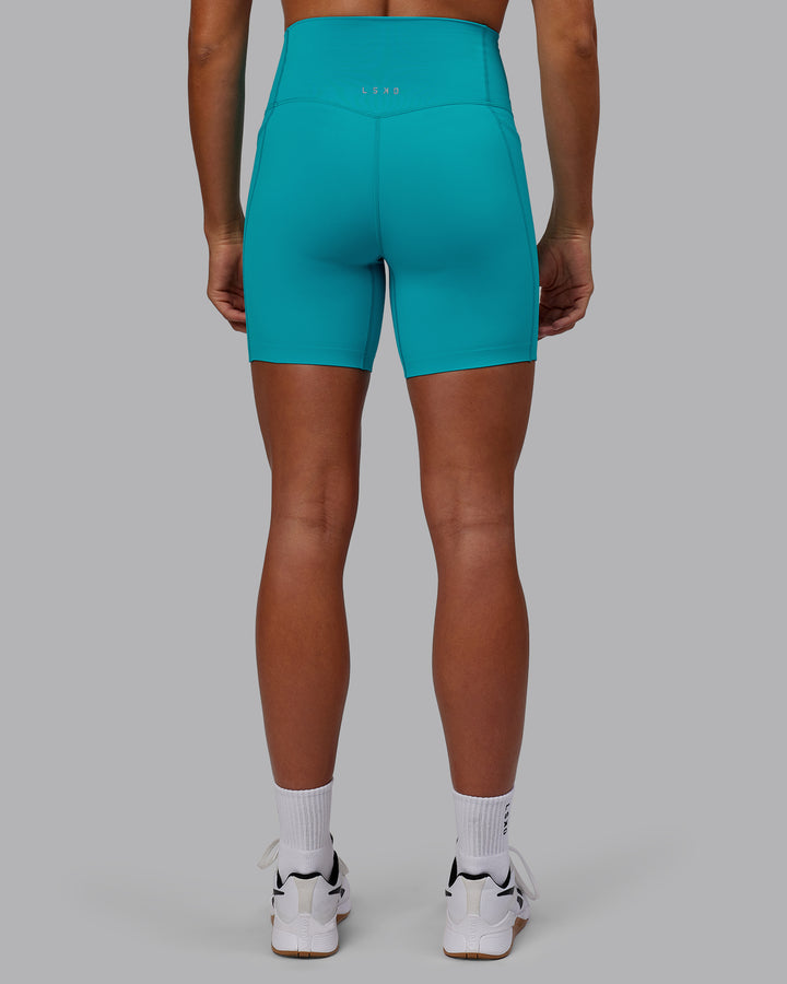 Woman wearing Elixir Mid Short Tights with Pockets - Blue Bird
