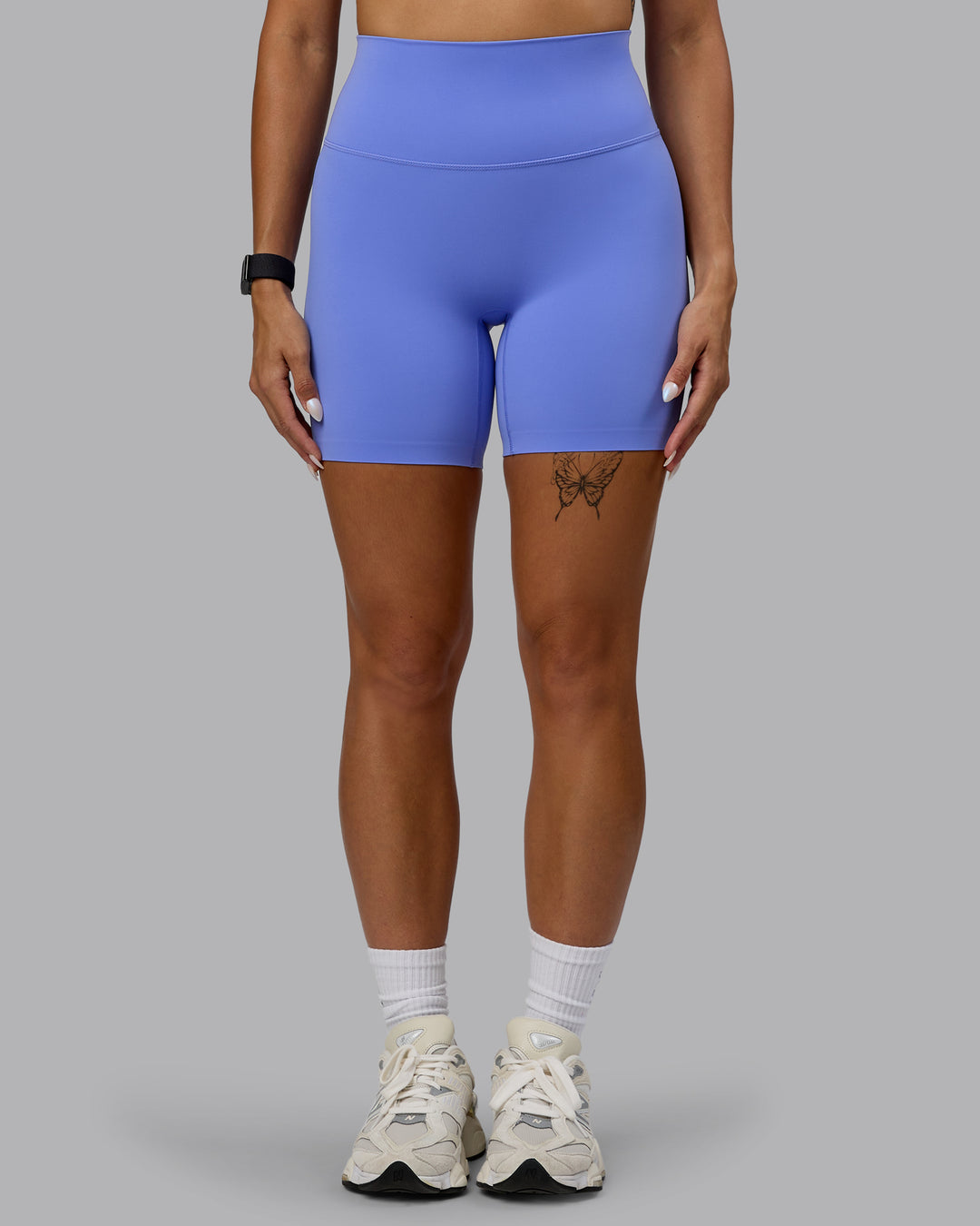 Woman wearing Elixir Mid Short Tights - Indulgent Blue