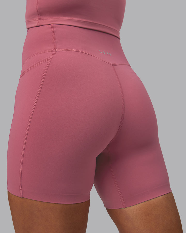 Woman wearing Elixir Mid Short Tights with Pockets - Mauve Haze
