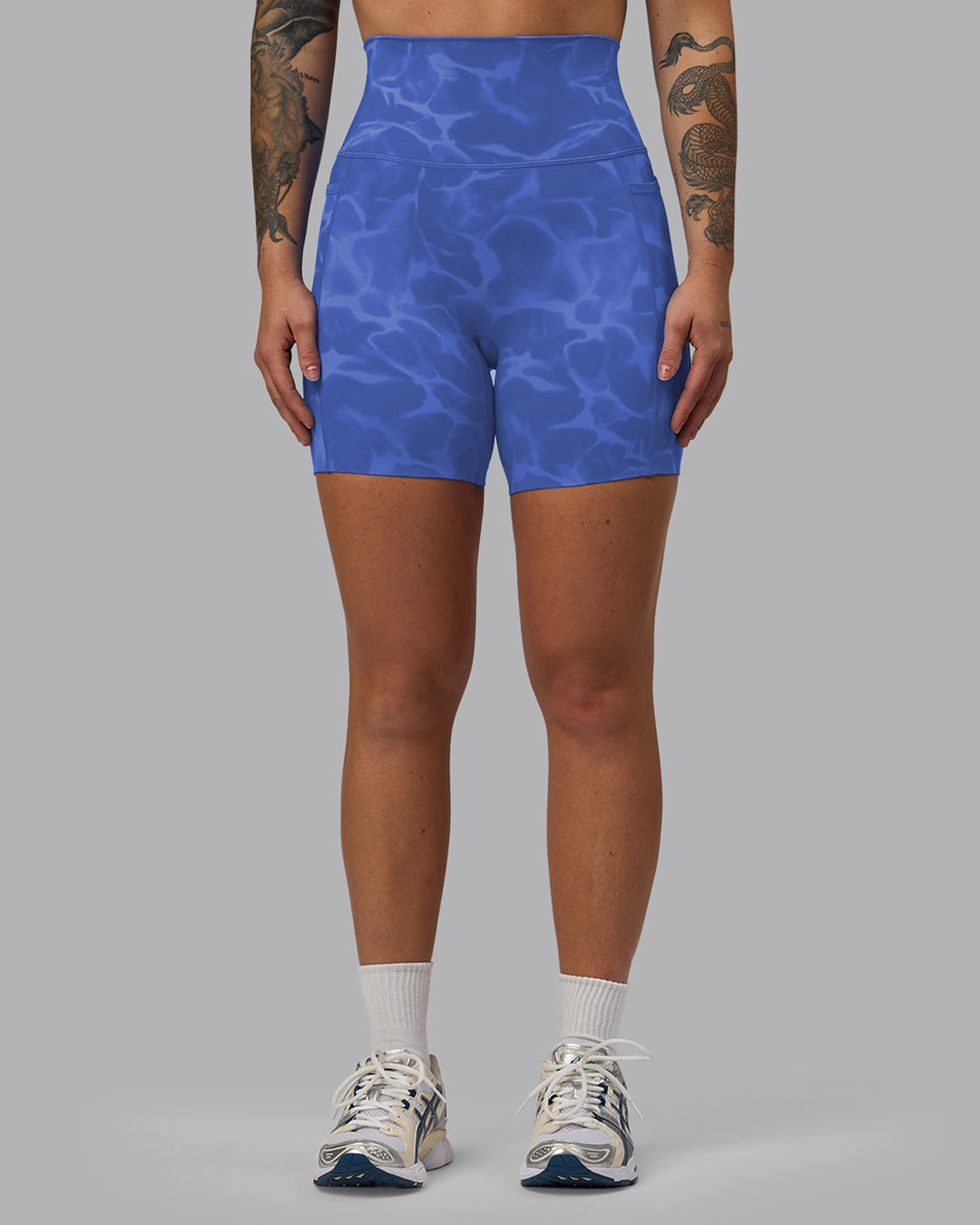 Woman wearing Elixir Mid Short Tights with Pockets - Tranquil-Power Cobalt