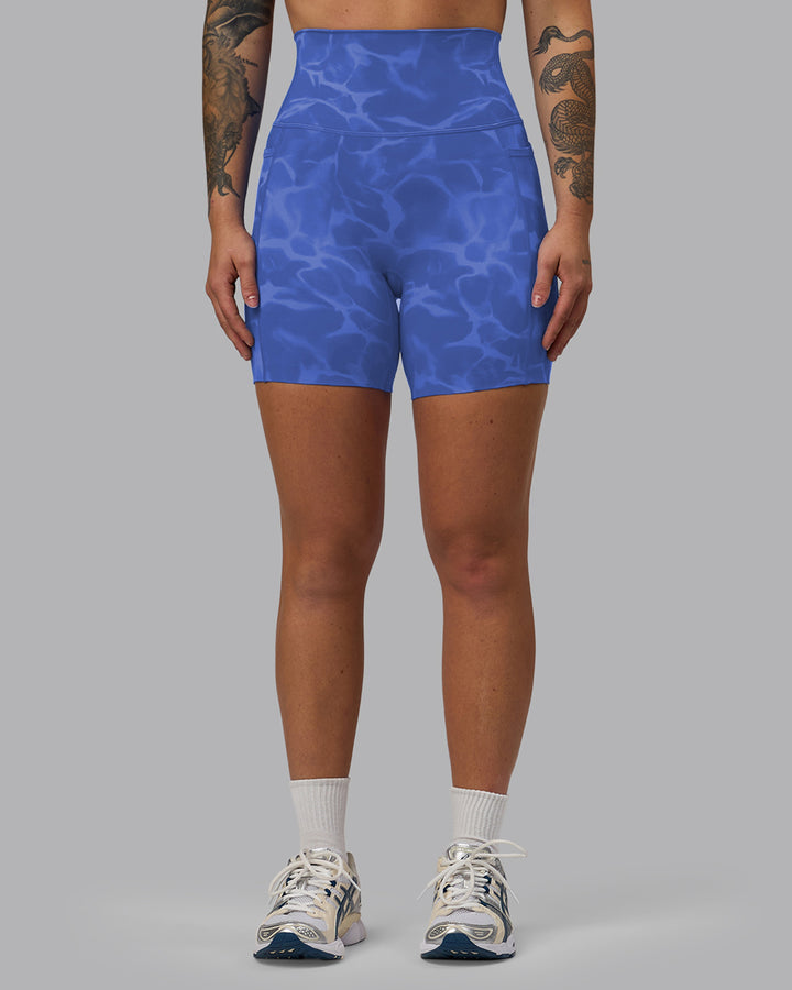 Woman wearing Elixir Mid Short Tights with Pockets - Tranquil-Power Cobalt
