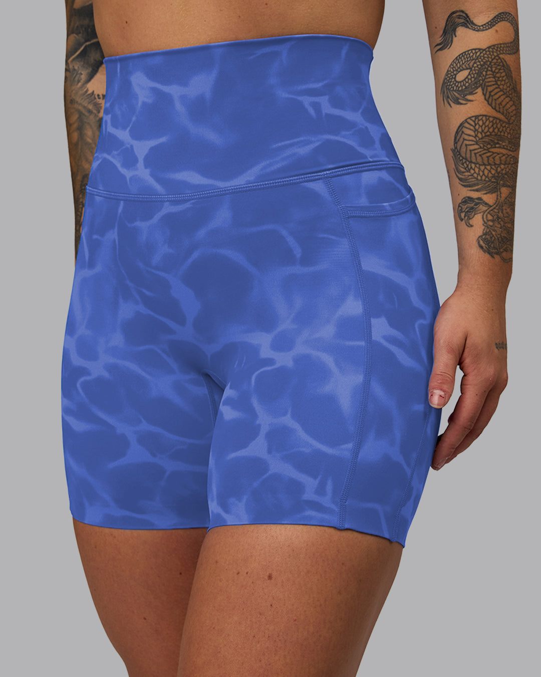 Woman wearing Elixir Mid Short Tights with Pockets - Tranquil-Power Cobalt