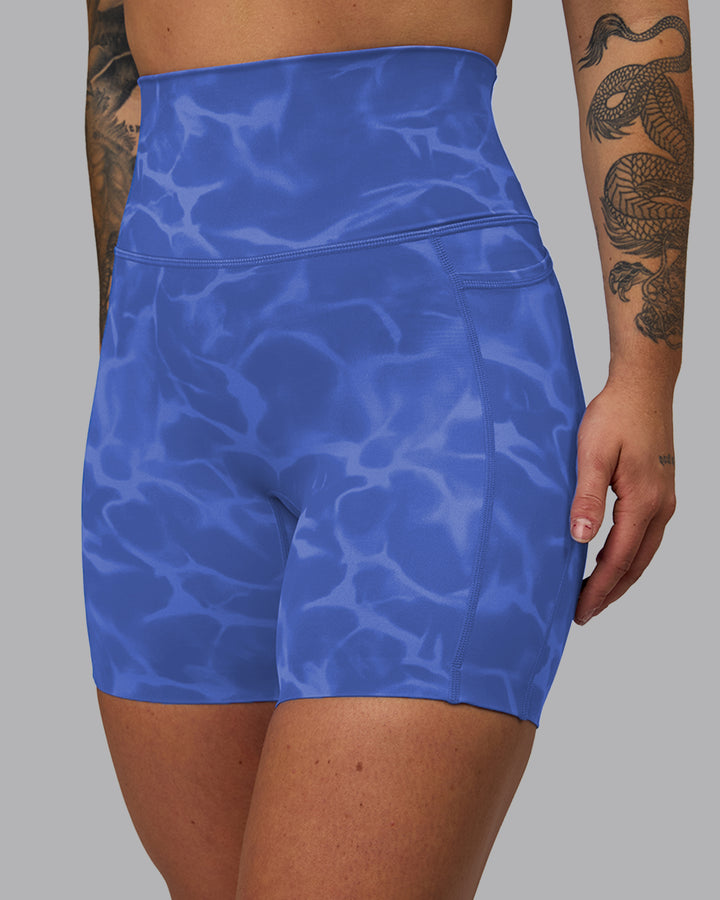 Woman wearing Elixir Mid Short Tights with Pockets - Tranquil-Power Cobalt
