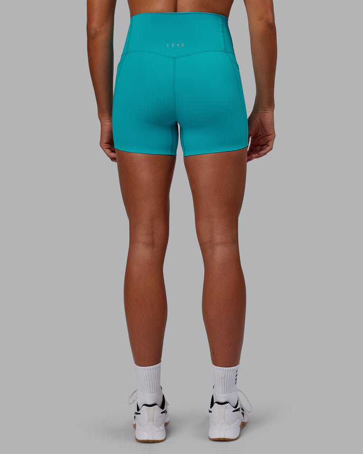 Woman wearing Elixir X-Short Tights With Pockets - Blue Bird
