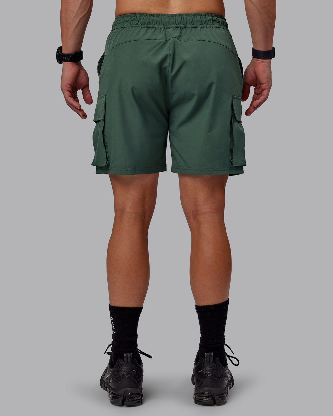 Man wearing Energy Stretch Performance Cargo Shorts - Cilantro