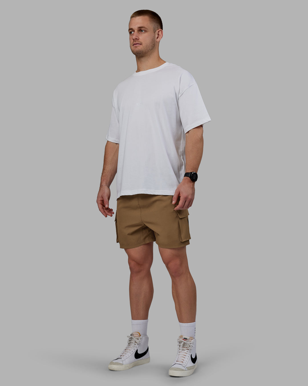 Man wearing Energy Stretch Performance Cargo Shorts - Otter