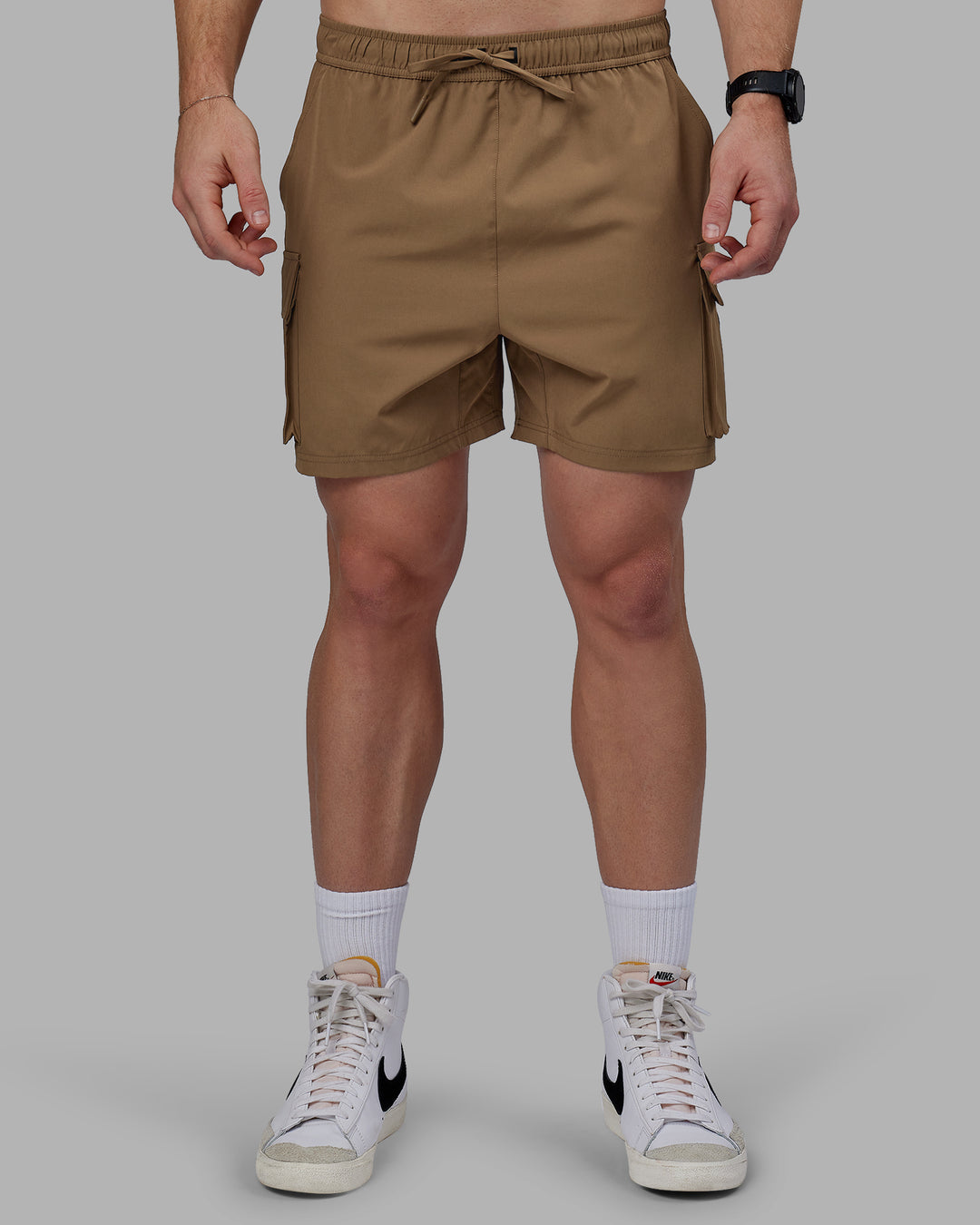 Man wearing Energy Stretch Performance Cargo Shorts - Otter