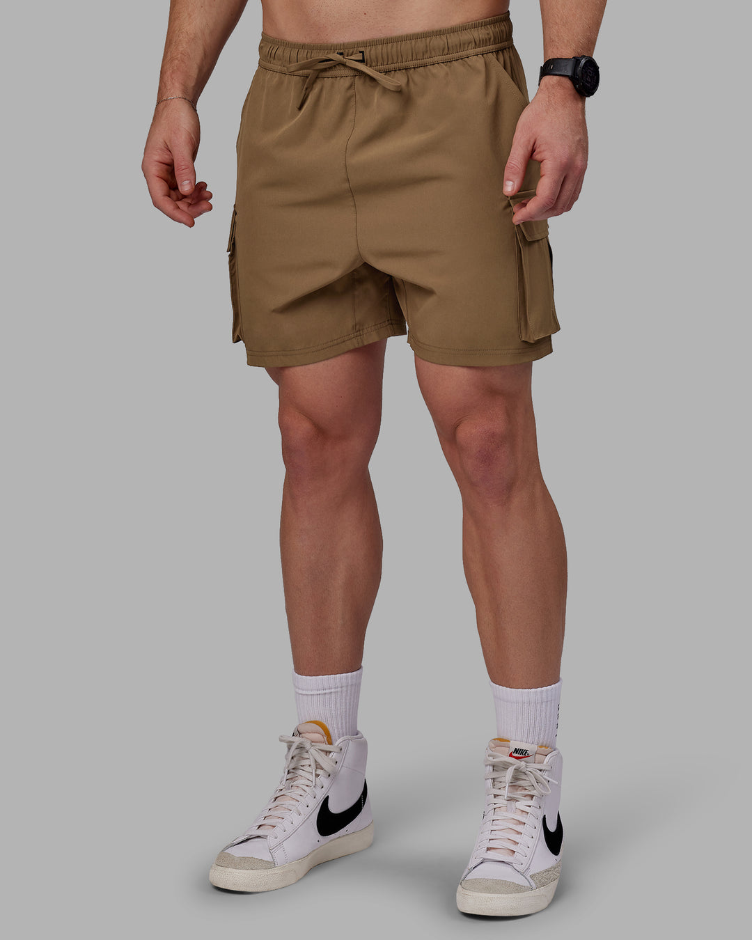 Man wearing Energy Stretch Performance Cargo Shorts - Otter